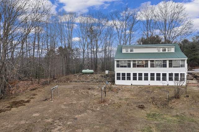 view of front of property featuring a sunroom