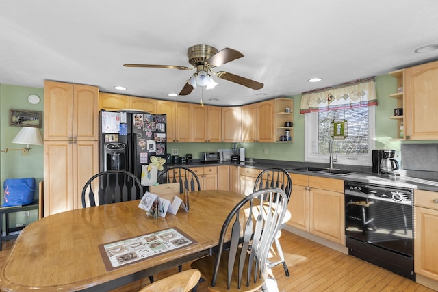 kitchen featuring black appliances, ceiling fan, light brown cabinets, and sink