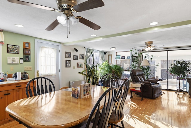 dining room featuring plenty of natural light, ceiling fan, and light wood-type flooring