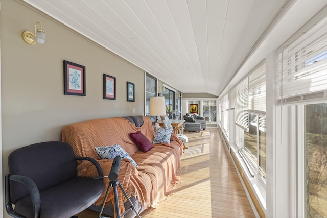 sunroom featuring lofted ceiling