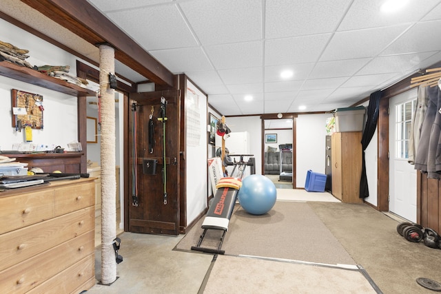 exercise area with a paneled ceiling