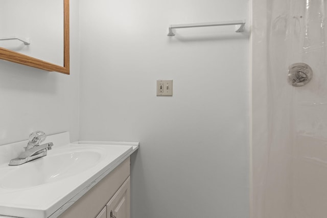 bathroom with vanity and walk in shower