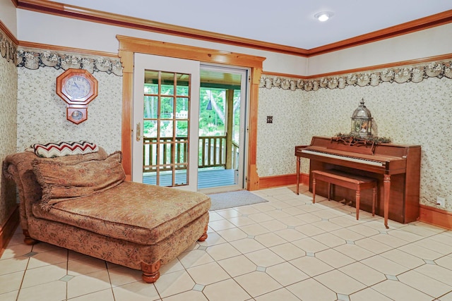 sitting room with wallpapered walls, baseboards, light tile patterned floors, and ornamental molding