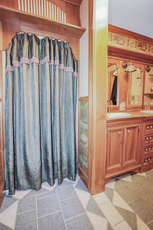 bathroom featuring vanity and stone tile flooring