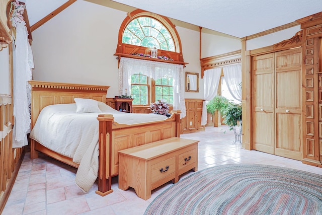 bedroom featuring vaulted ceiling