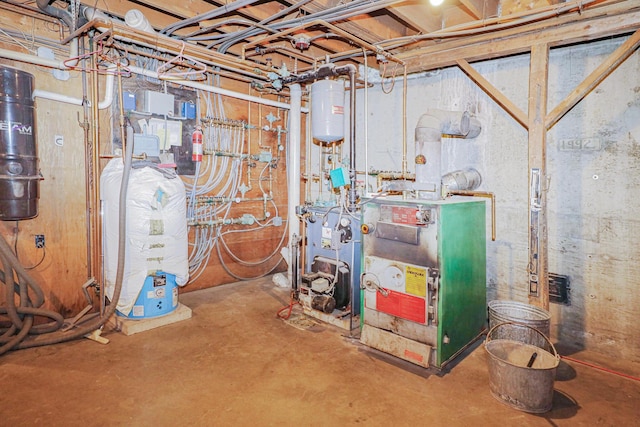 utility room with water heater and a heating unit