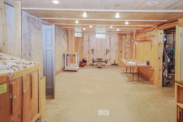 below grade area with wooden ceiling and wood walls