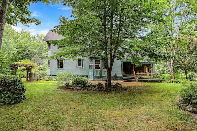 view of yard with covered porch