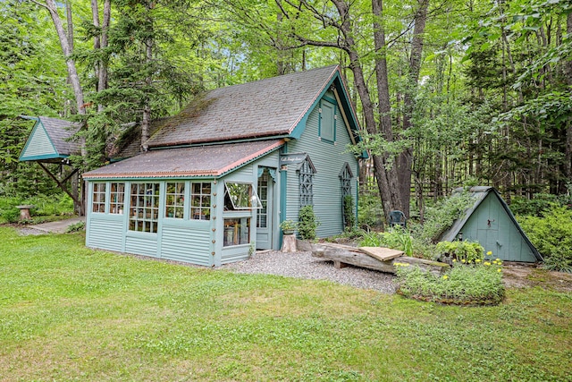 view of outbuilding with a wooded view