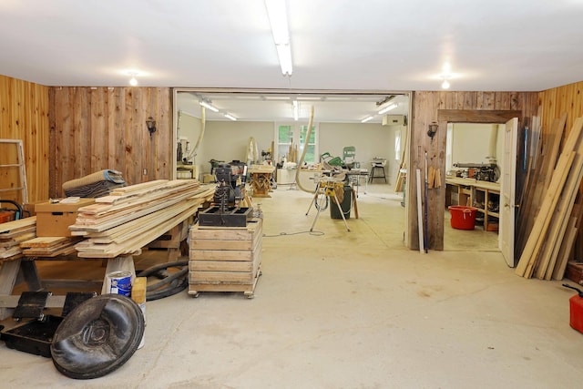 below grade area with wood walls and a workshop area