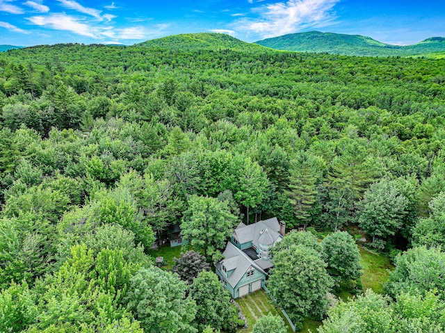 bird's eye view with a mountain view and a forest view