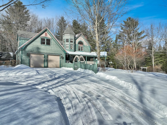 view of front facade featuring a garage and covered porch