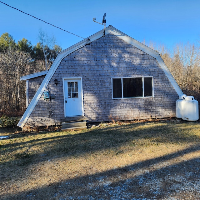 rear view of house with a lawn