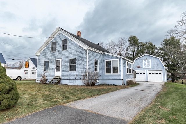 view of front of home featuring an outdoor structure and a front lawn