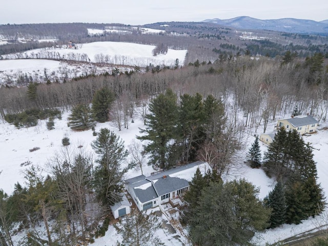 snowy aerial view with a mountain view