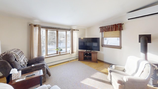 living room featuring a baseboard radiator, a wall unit AC, and light wood-type flooring