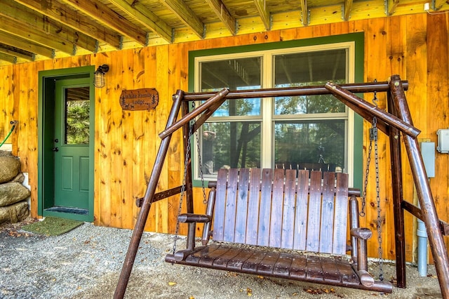 exterior space featuring wooden walls