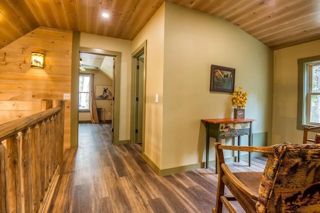 hallway featuring dark hardwood / wood-style flooring, lofted ceiling, and wood ceiling