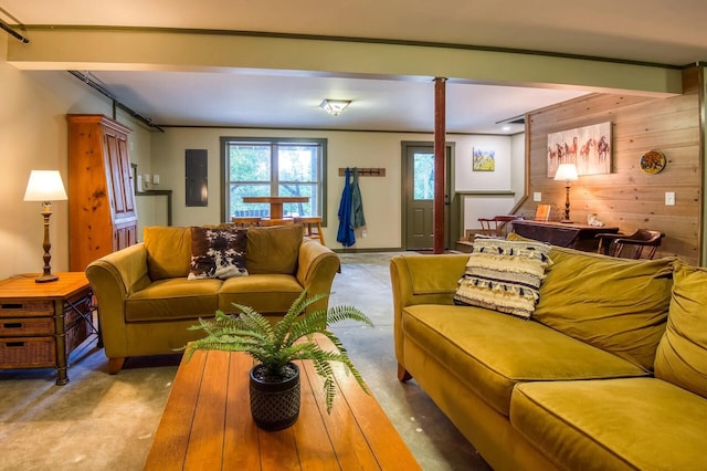 living room featuring wooden walls and beamed ceiling