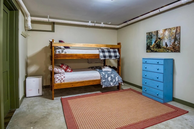 bedroom with concrete floors