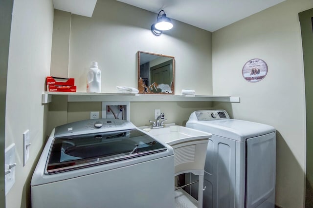 laundry area with independent washer and dryer