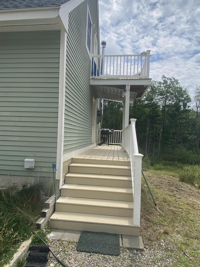 doorway to property featuring a wooden deck