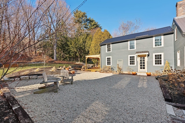 back of house with a patio and a pergola