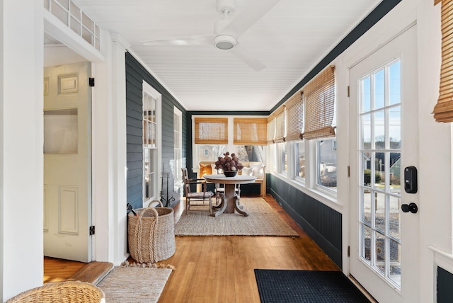 hallway with hardwood / wood-style floors