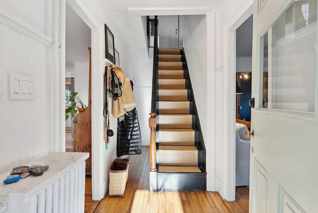 stairway with hardwood / wood-style flooring