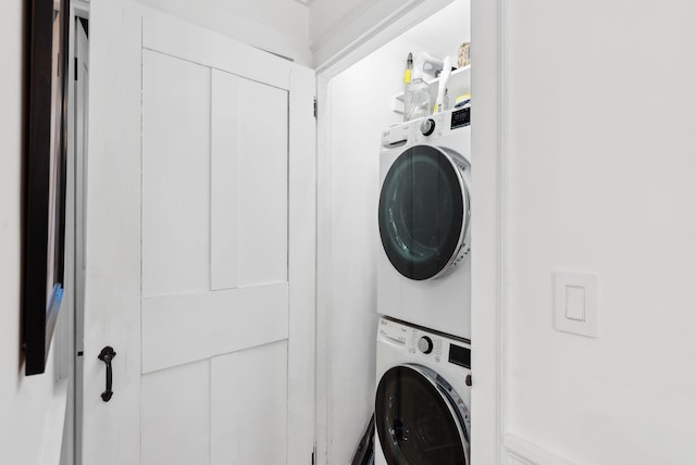 laundry area with stacked washer / dryer