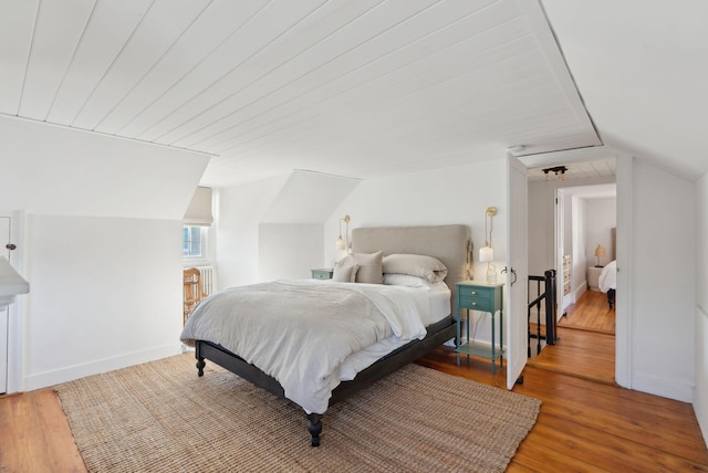 bedroom with wooden ceiling, wood-type flooring, and vaulted ceiling