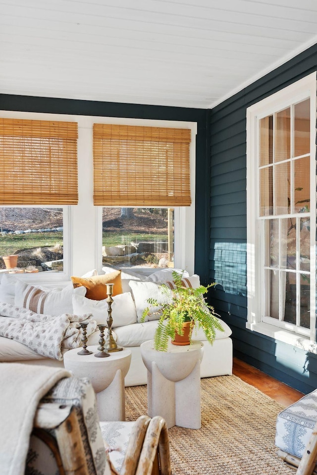 sunroom featuring wooden ceiling