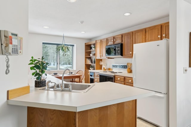 kitchen with sink, white appliances, and kitchen peninsula