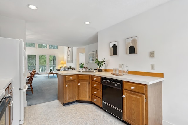 kitchen featuring sink, black dishwasher, kitchen peninsula, white fridge, and light carpet