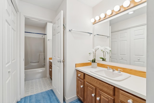 bathroom featuring vanity and washtub / shower combination