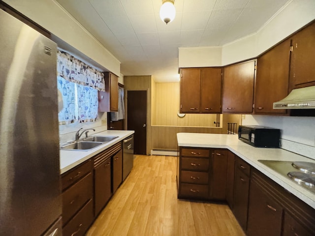 kitchen with stainless steel appliances, baseboard heating, sink, and light hardwood / wood-style floors