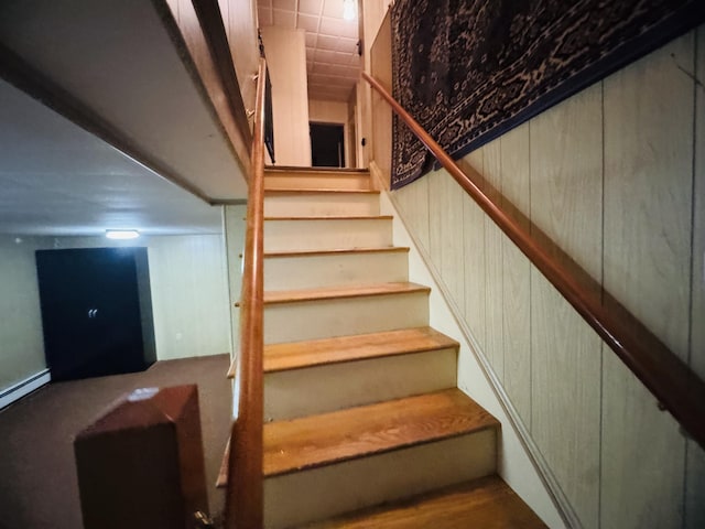 staircase with baseboard heating