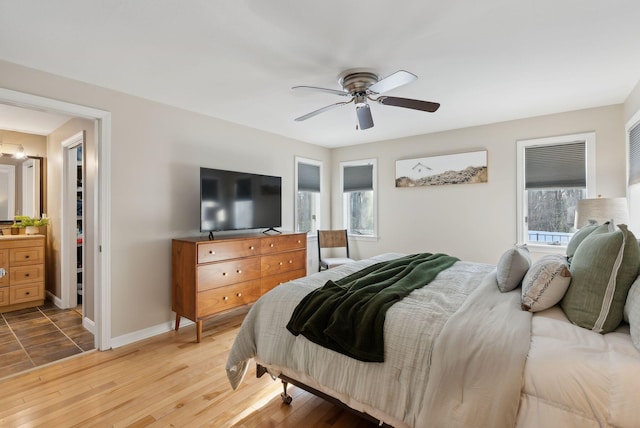 bedroom with light wood-type flooring and ceiling fan