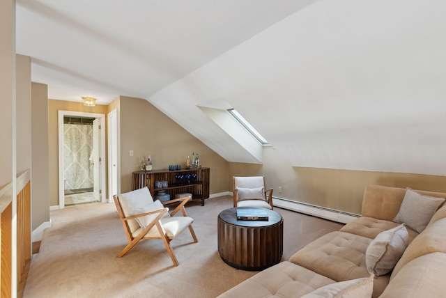 interior space featuring baseboard heating and lofted ceiling with skylight