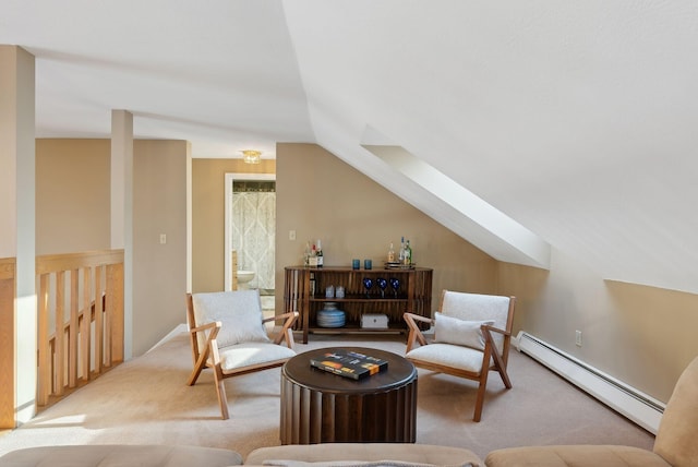 sitting room featuring baseboard heating, vaulted ceiling, and light carpet