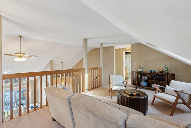 carpeted living room featuring lofted ceiling and ceiling fan