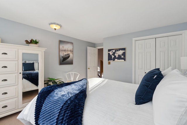 bedroom with a closet and carpet