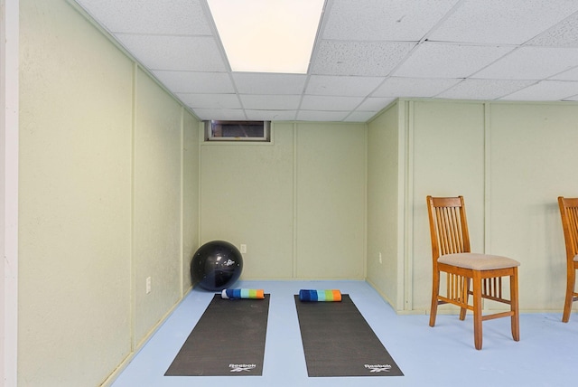 exercise room with a drop ceiling