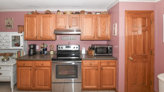 22 Jewett Rd, Raymond, ME 04071 - kitchen featuring stainless steel appliances, dark countertops, brown cabinetry, and ventilation hood