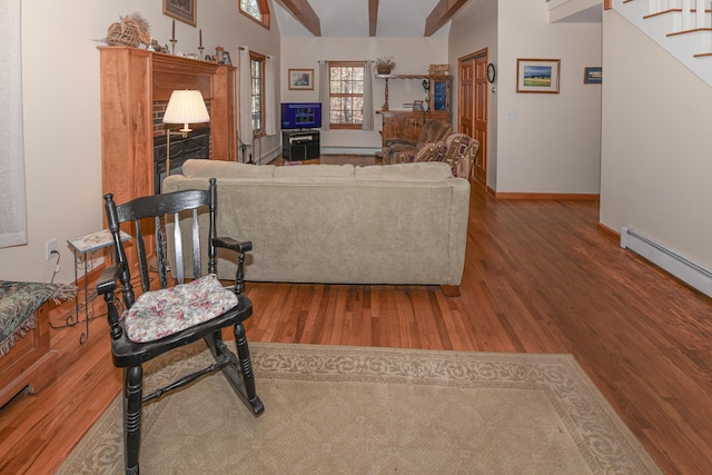 22 Jewett Rd, Raymond, ME 04071 - living room featuring stairs, baseboards, lofted ceiling with beams, and wood finished floors