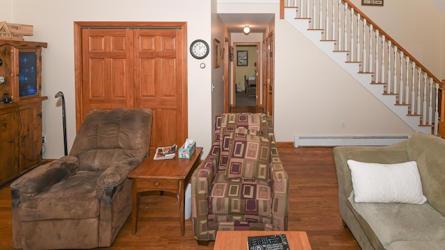 22 Jewett Rd, Raymond, ME 04071 - living area with a baseboard radiator, wood finished floors, and stairway