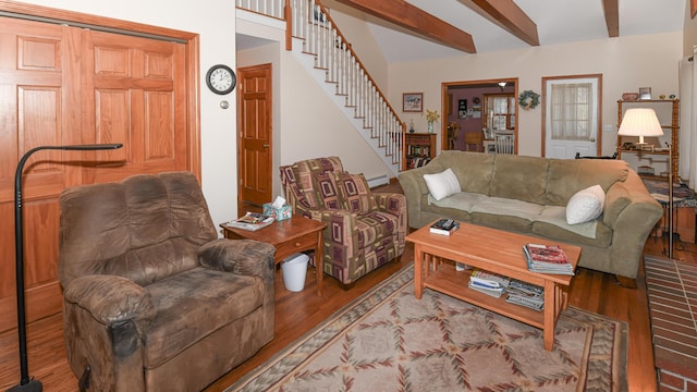 22 Jewett Rd, Raymond, ME 04071 - living room featuring beamed ceiling, wood finished floors, and stairs