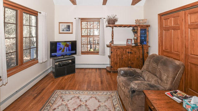 22 Jewett Rd, Raymond, ME 04071 - living area with baseboard heating and wood finished floors