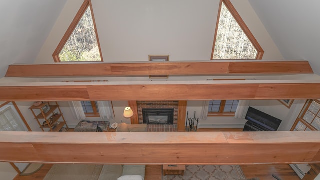 22 Jewett Rd, Raymond, ME 04071 - details with a brick fireplace, a baseboard radiator, and wood finished floors