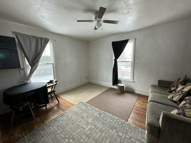 office featuring hardwood / wood-style flooring, ceiling fan, and a textured ceiling